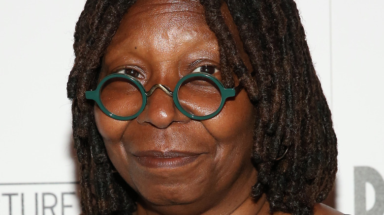 Whoopi Goldberg posing for photo