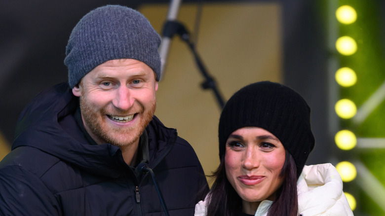 Meghan Markle and Prince Harry smiling.