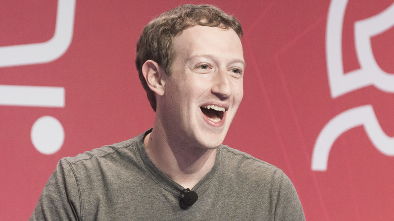 Mark Zuckerberg laughing on stage