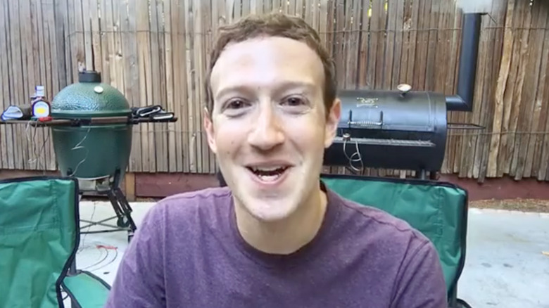 Mark Zuckerberg sitting in front of a grill