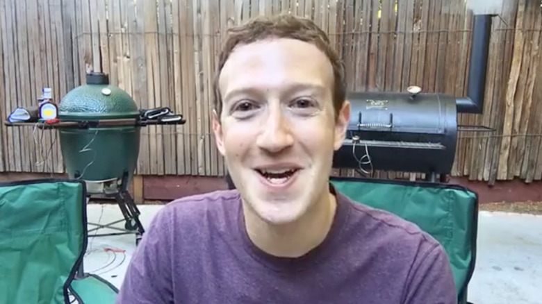 Mark Zuckerberg sitting in front of a grill