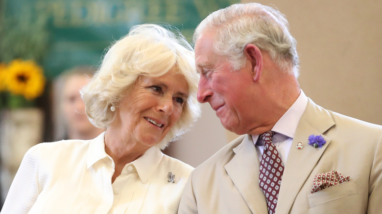 King Charles and Queen Camilla gaze at each other adoringly.