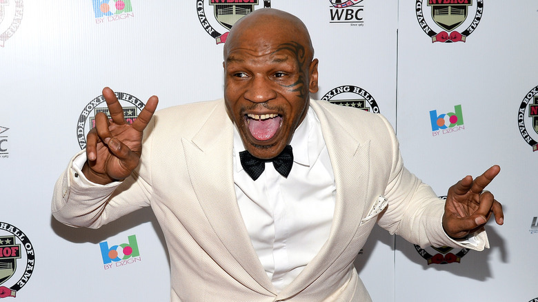 Mike Tyson making a silly face on red carpet
