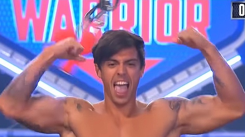 John Pearce showing muscles in American Ninja Warrior