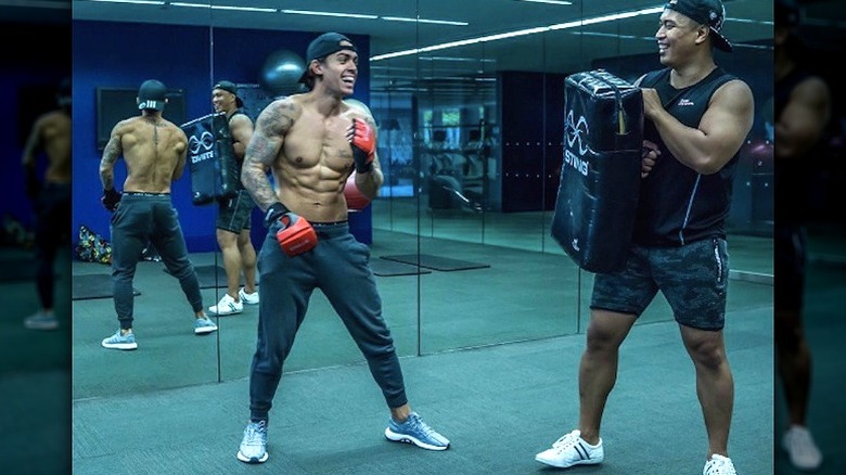John Pearce working out with a friend