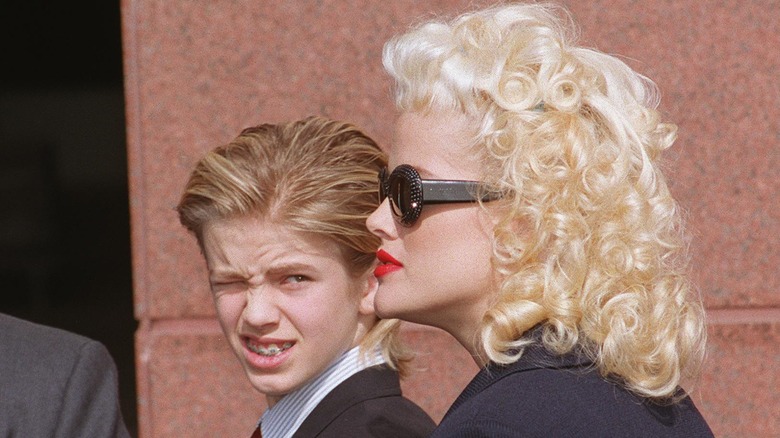 Anna Nicole Smith looks ahead as Daniel Wayne Smith glances at her