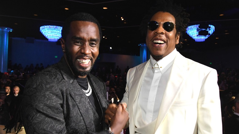Diddy shaking hands with Jay-Z