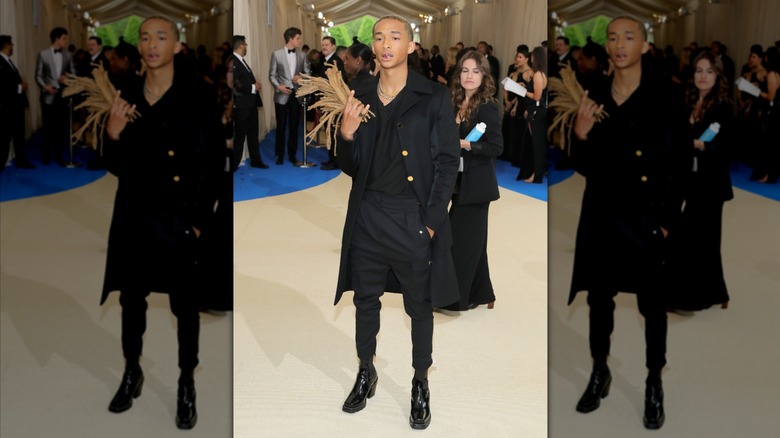 Jaden Smith's holding detached locs at the 2017 Met Gala.