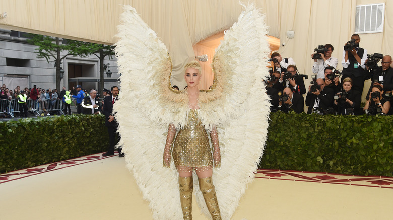 Katy Perry wearing a winged Versace getup in 2018 at the Met Gala.
