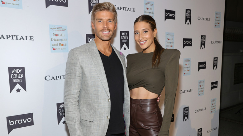 Amanda Batula and Kyle Cooke smile on the red carpet