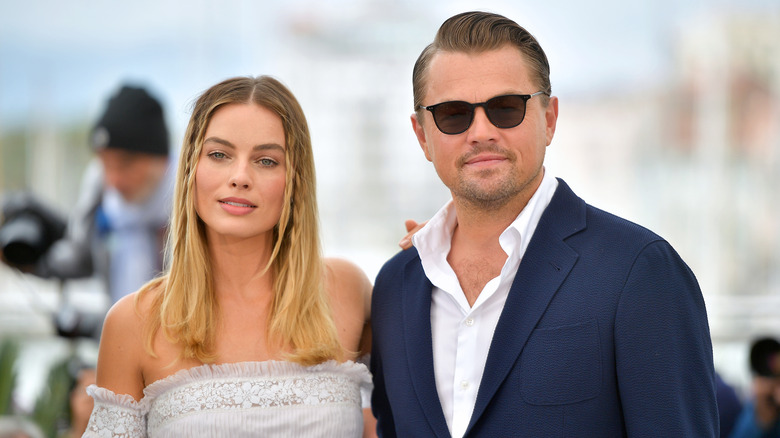 Margot Robbie and Leonardo DiCaprio smiling