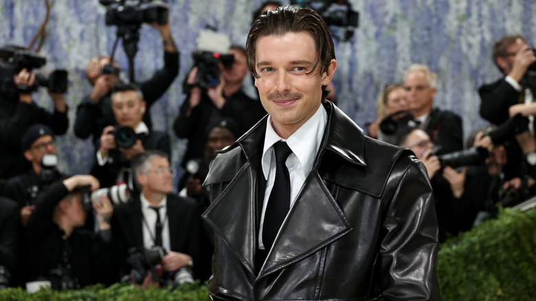 Patrick Schwarzenegger wears a leather jacket over a suit at the 2026 Met Gala.