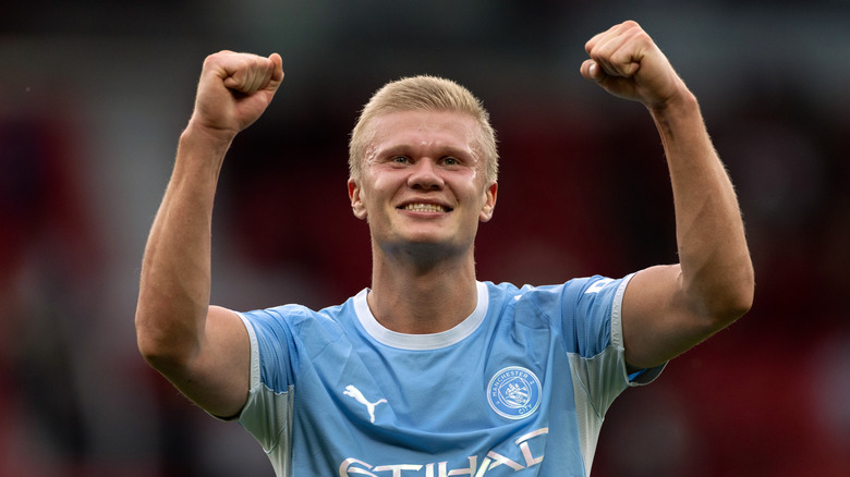 Up-close photo of soccer player Erling Haaland smiling and celebrating