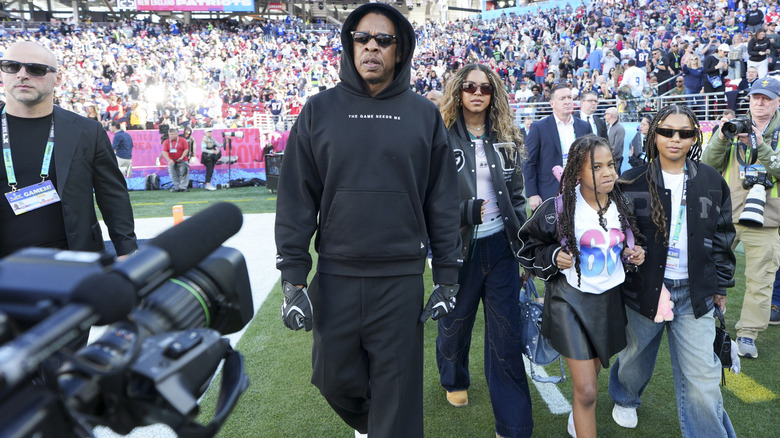 Jay-Z attends Super Bowl LX with Blue Ivy and Rumi Carter and a friend