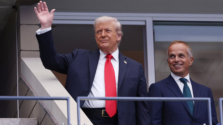 Donald Trump waving at the US Open.