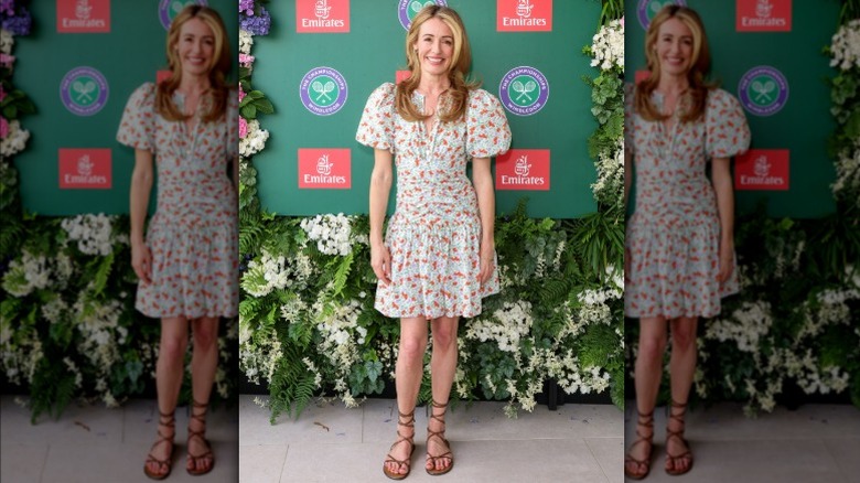 Cat Deeley wearing a floral-print dress and gladiator sandals at Wimbledon 2025