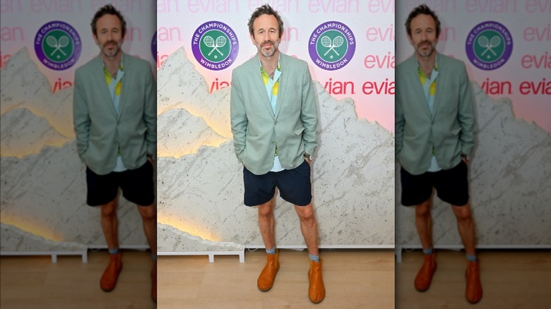 Chris O'Dowd wearing a blazer, boots and shorts at Wimbledon 2025