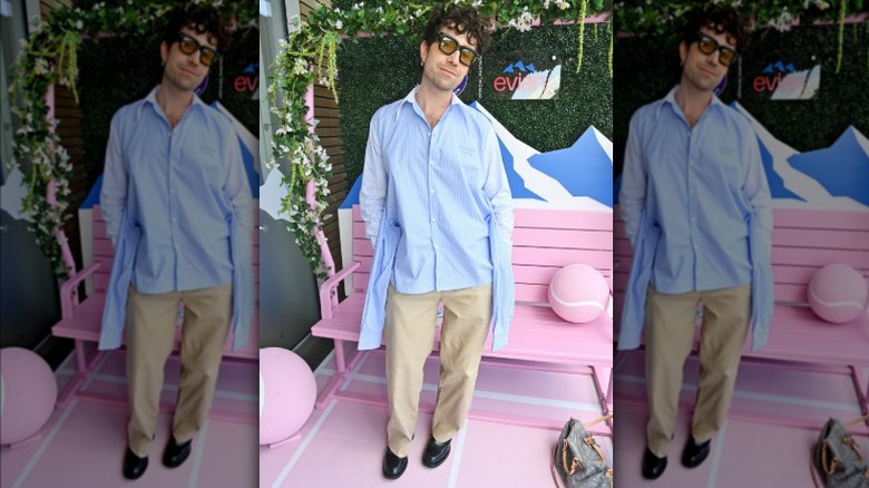 Nick Grimshaw wearing a shirt with four sleeves at Wimbledon 2025