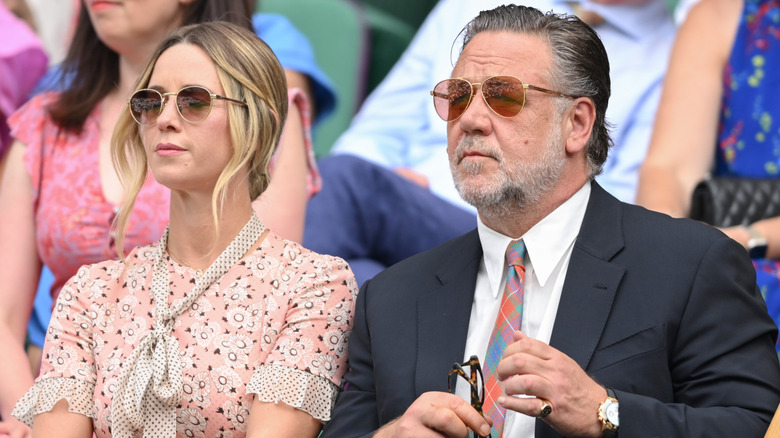 Britney Theriot and Russell Crowe seated in the crowd at Wimbledon 2025