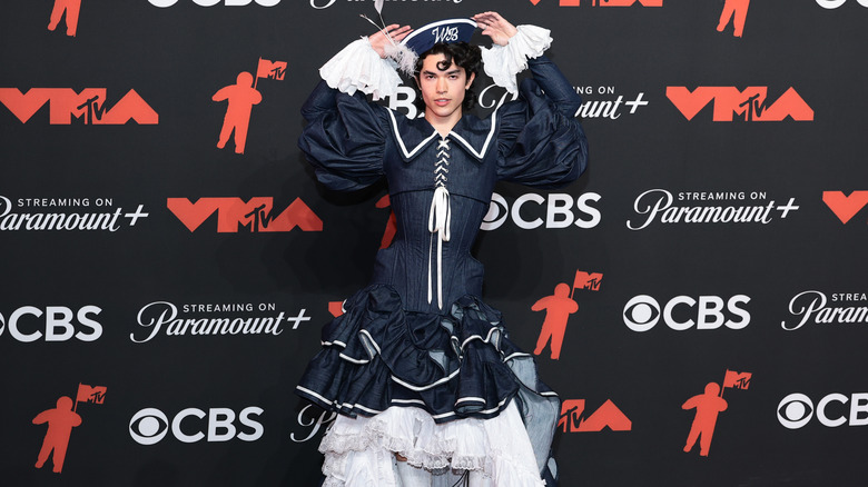 Conan Gray wearing an over-the-top sailor outfit on the red carpet.