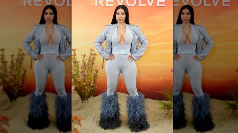 Cardi B in blue furry boots, leggings and jacket