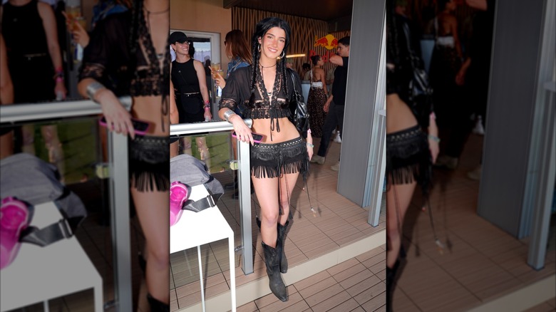 Charli D'Amelio in all black fringe cowgirl outfit