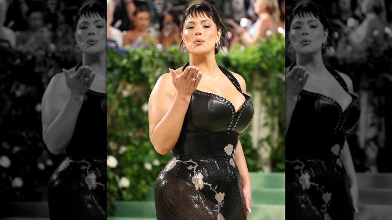 Ashley Graham blowing kiss corset