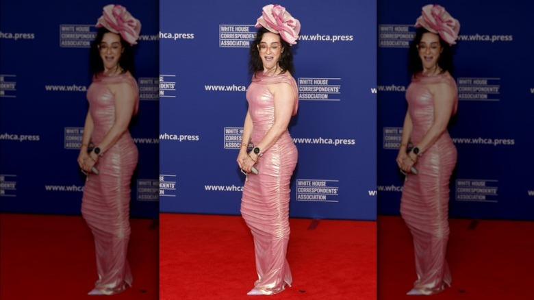 Kennedy wearing a pink rose hat and matching dress at the White House Correspondents' Dinner