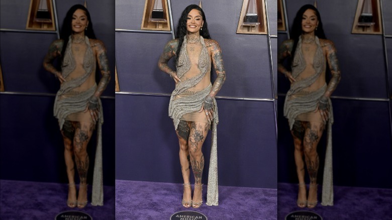 Kehlani wearing a draped silver dress at the AMAs