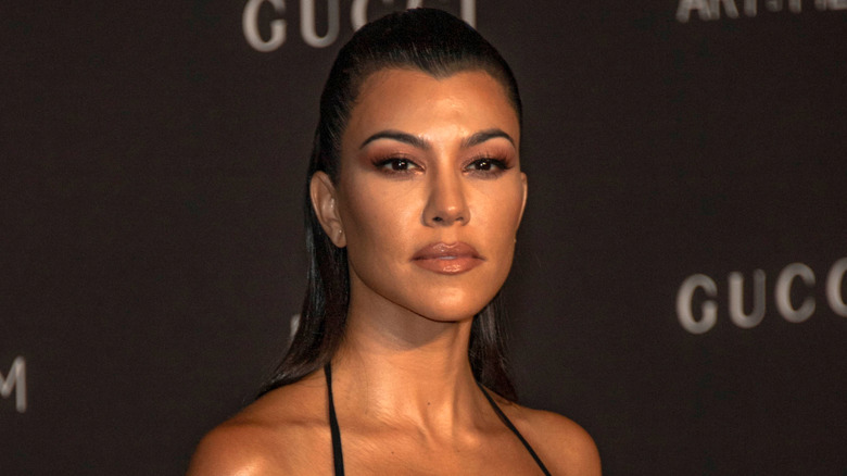 Kourtney Kardashian in a black dress in 2018