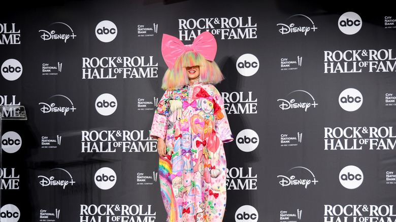 Sia wearing a colorful dress