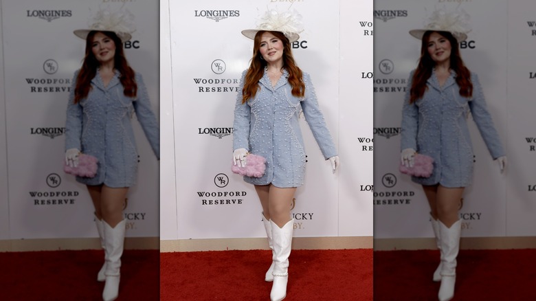 Lana Scott on the red carpet in a white hat