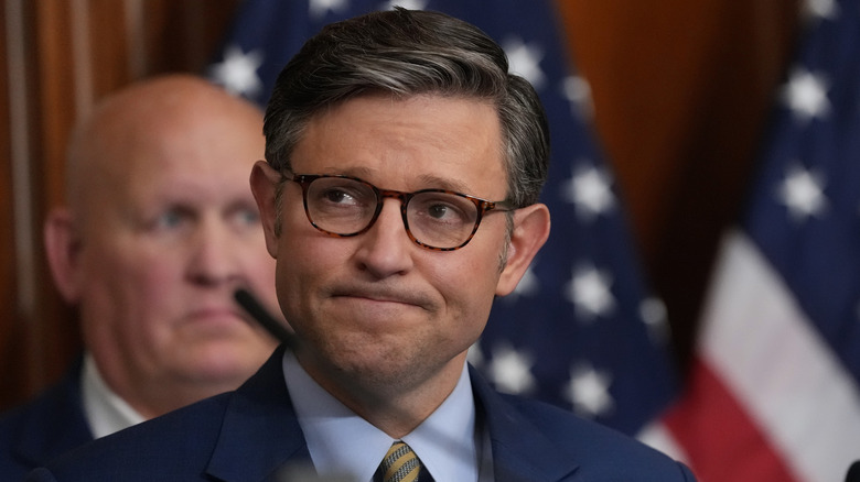 Mike Johnson (R-LA) listens at House Homeland Security Chairman Mark Green (R-TN) speaks to the media on May 22, 2025.