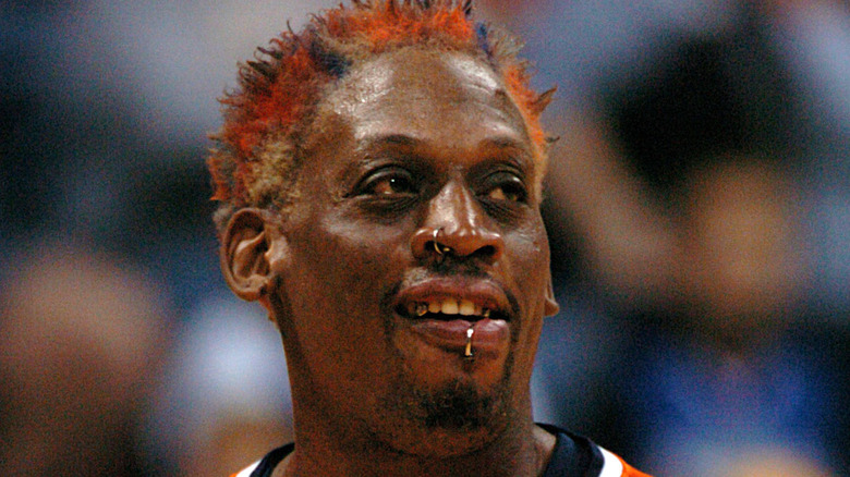 Dennis Rodman on basketball court, smiling