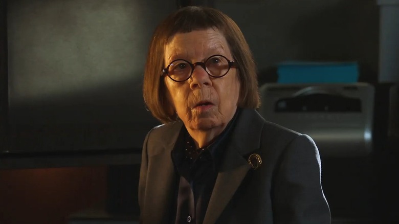 Linda Hunt, as Henrietta "Hetty" Lange, displays a worried expression.