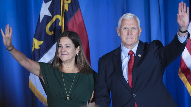 Mike and Karen Pence waving to a crowd.