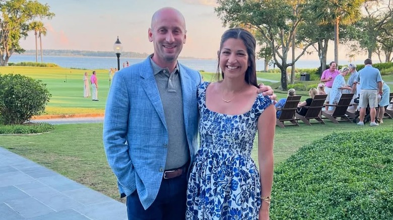 Stephen Miller posing with arm around Katie Miller's shoulders outdoors