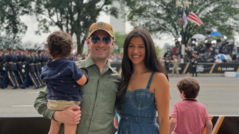 Stephen Miller poses with Katie and their son during Trump's military birthday parade