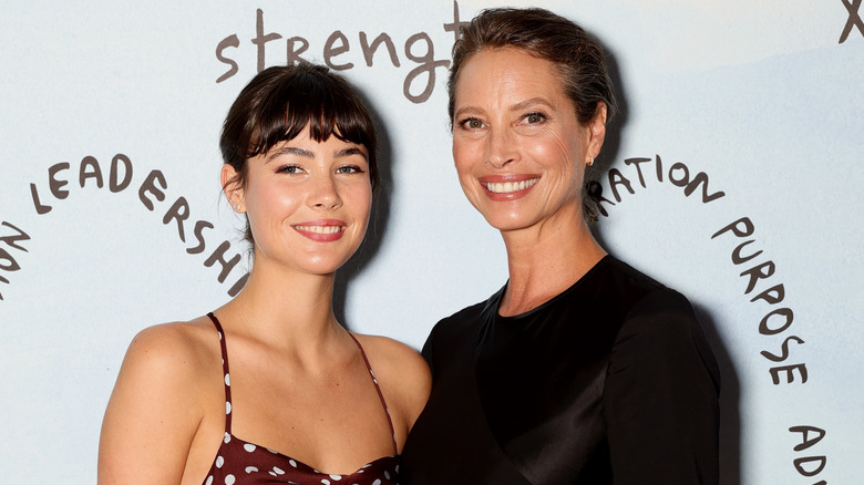 Christy Turlington and Grace Burns pose together on red carpet