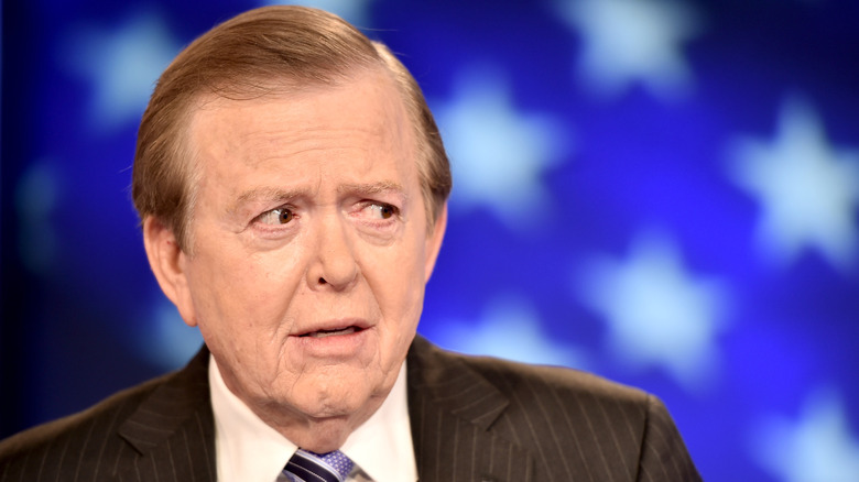 Lou Dobbs glancing sideways while appearing on Fox News
