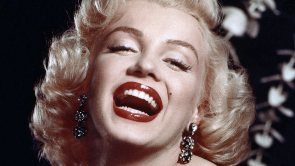 Marilyn Monroe smiling with mouth open