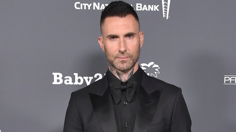 Adam Levine wearing a suit