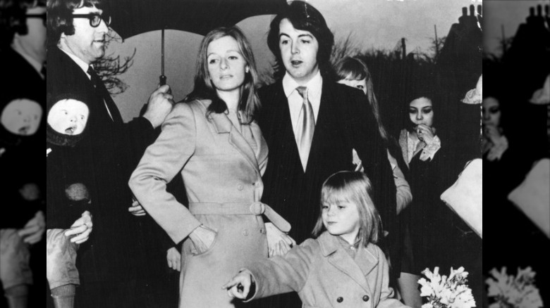 Linda McCartney, Paul McCartney, and Heather McCartney posing for a photo