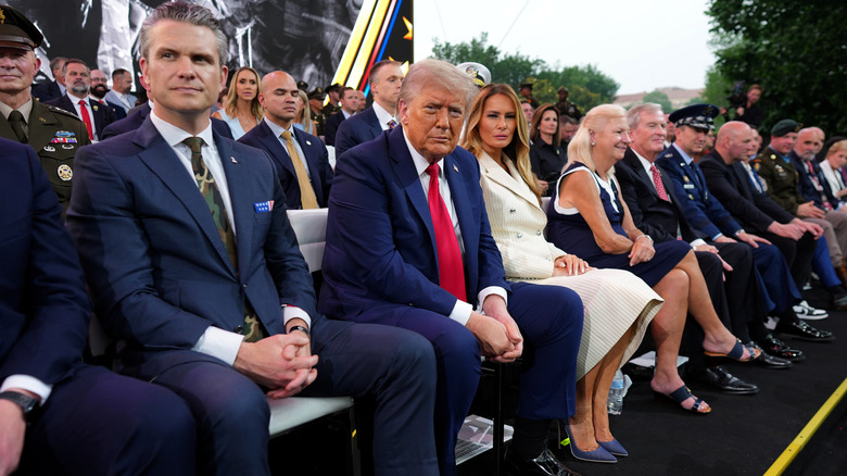 Donald and Melania Trump and Pete Hegseth at parade