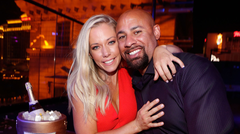 Kendra Wilkinson and Hank Baskett seated at a venue