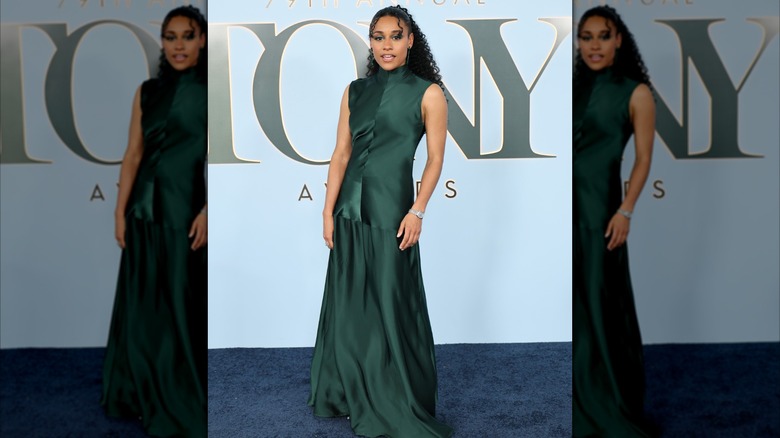 Ariana DeBose posing at the 2026 Tony Awards in a green dress.