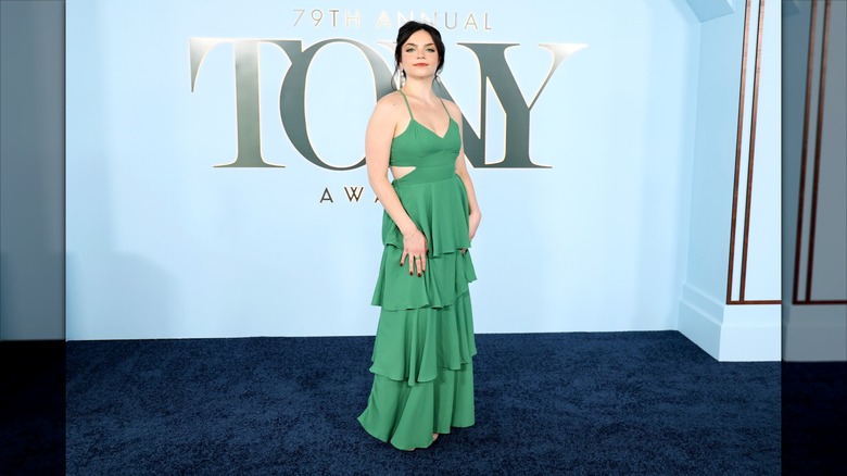 Ella Stiller posing in a green dress at the 2026 Tony Awards.