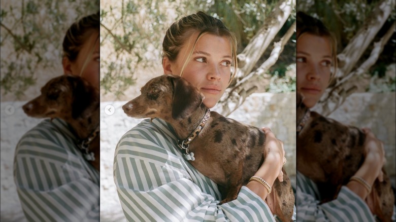 Sofia Richie posing with dog Hershula