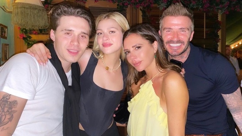 Nicola Peltz and Brooklyn Beckham with David and Victoria Beckham