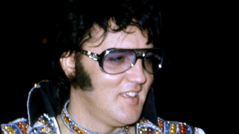 Elvis Presley posing for cameras in 1976